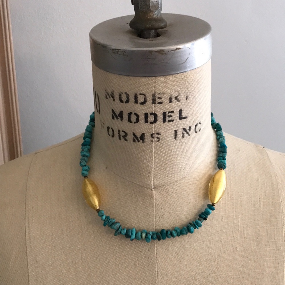 Necklace with turquoise and gold beads.